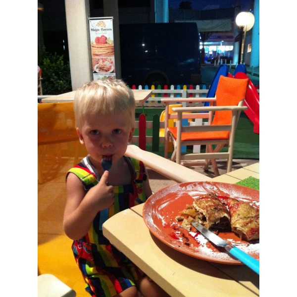Egor is having a pancakes. Cyprus, 2014